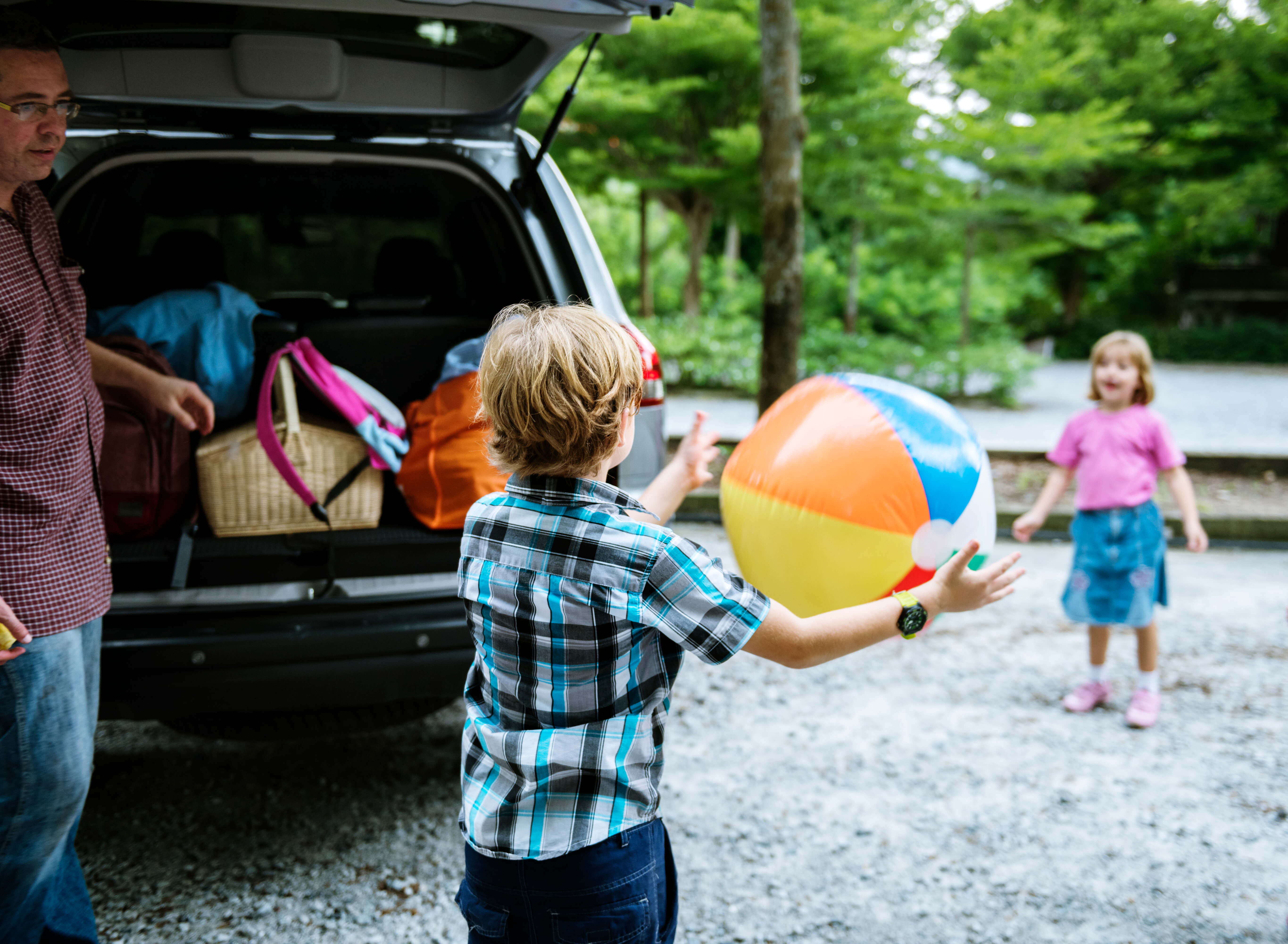 Kids Playing Behind a Car