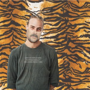 man in custom joe exotic face mask and tiger king costume