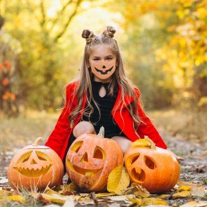 girl with custom jackolantern face mask