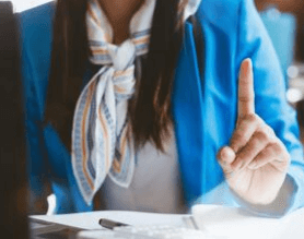 A Woman Holding Her Pointer Finger UP