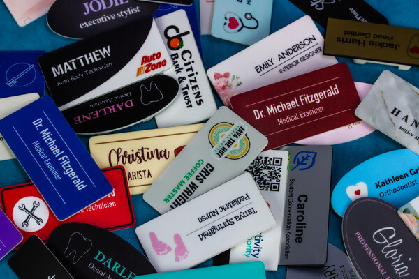 A pile of Custom name tags